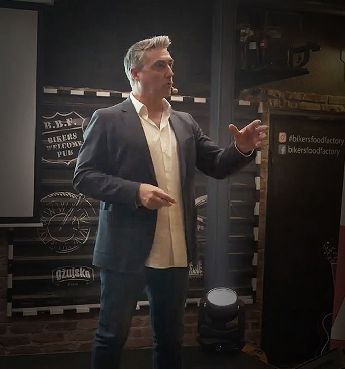 Guy Pardillos speaking on stage